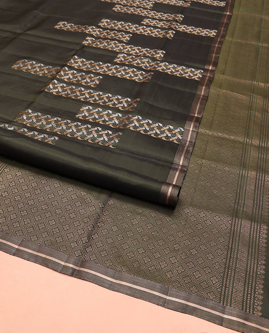 Green Mayuri Soft Silk Saree, Steeped in Richness with Paisley Buttas on Its Body, Subtle Zari Piping Border,  Pallu of Jaal Designs, and Paired with Matching Blouse