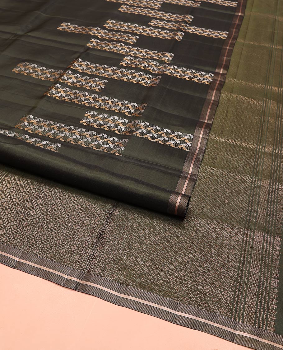 Green Mayuri Soft Silk Saree, Steeped in Richness with Paisley Buttas on Its Body, Subtle Zari Piping Border,  Pallu of Jaal Designs, and Paired with Matching Blouse