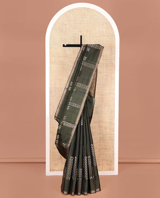 Green Mayuri Soft Silk Saree, Steeped in Richness with Paisley Buttas on Its Body, Subtle Zari Piping Border,  Pallu of Jaal Designs, and Paired with Matching Blouse