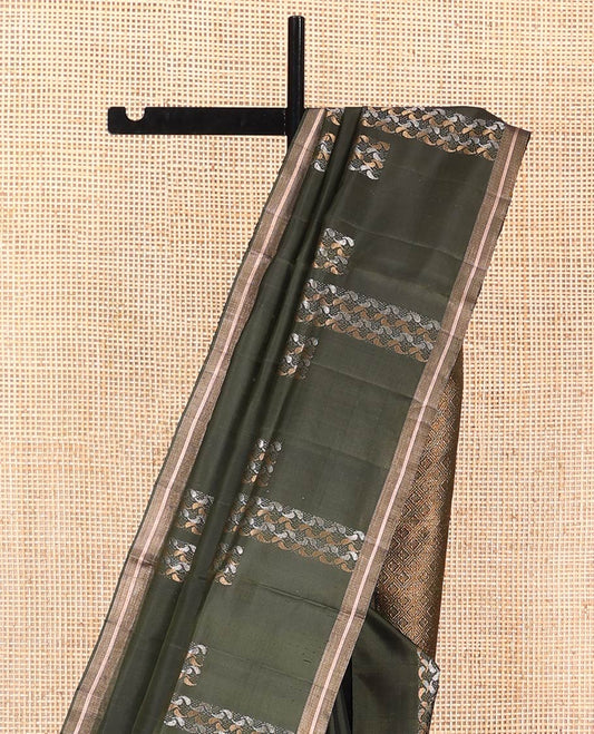 Green Mayuri Soft Silk Saree, Steeped in Richness with Paisley Buttas on Its Body, Subtle Zari Piping Border,  Pallu of Jaal Designs, and Paired with Matching Blouse