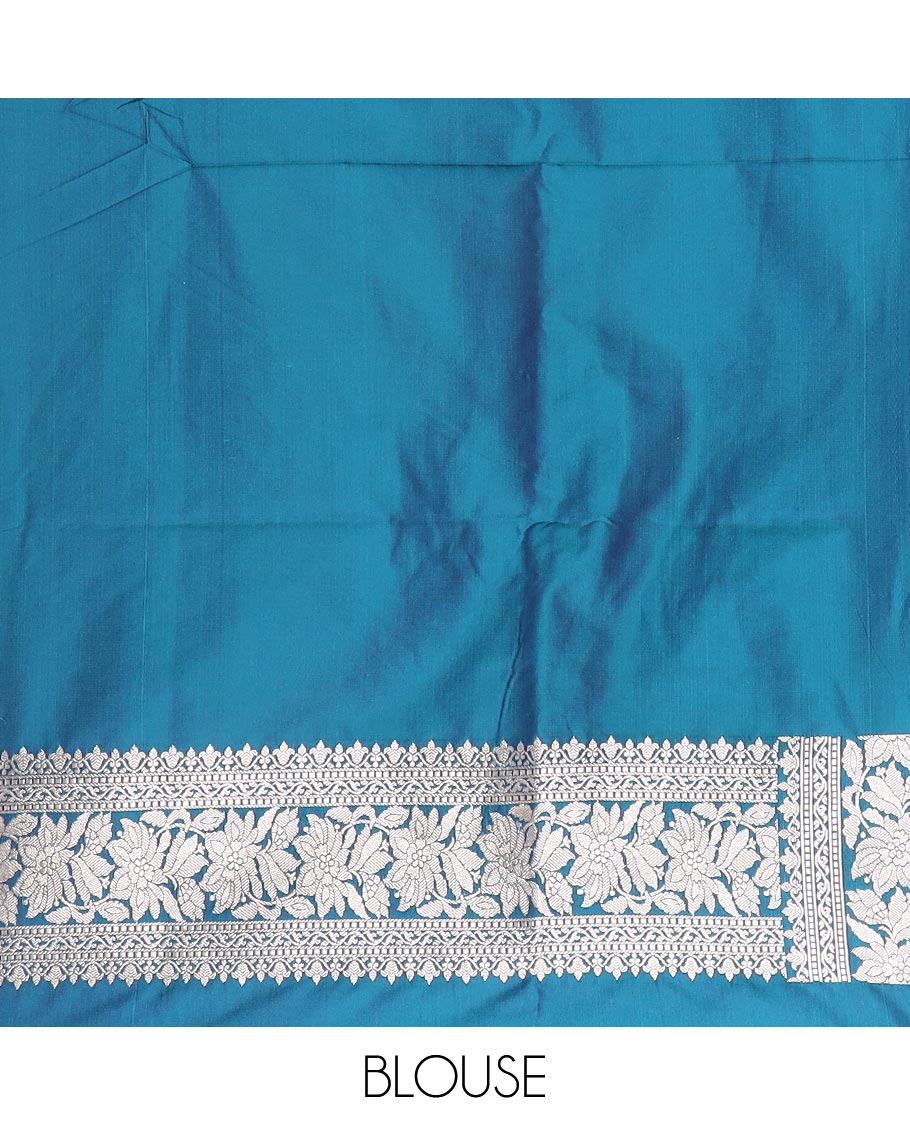 Blue zari buttas mushru silk saree, self-border of floral creeper designs, and flower vase buttas woven pallu