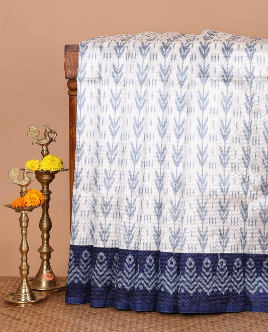 White ikat-style printed Litchi crushed saree, contrast blue ikat border, pallu of ikat chevron & dots & ikat printed blouse