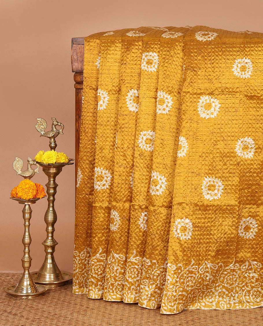 Mustard batik-floral buttas printed litchi crushed saree, batik-floral printed border, printed pallu & butta print blouse
