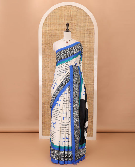 Chikku color swastika & Hindi typography printed jute cotton saree, contrast printed border, printed pallu & plain royal blue blouse