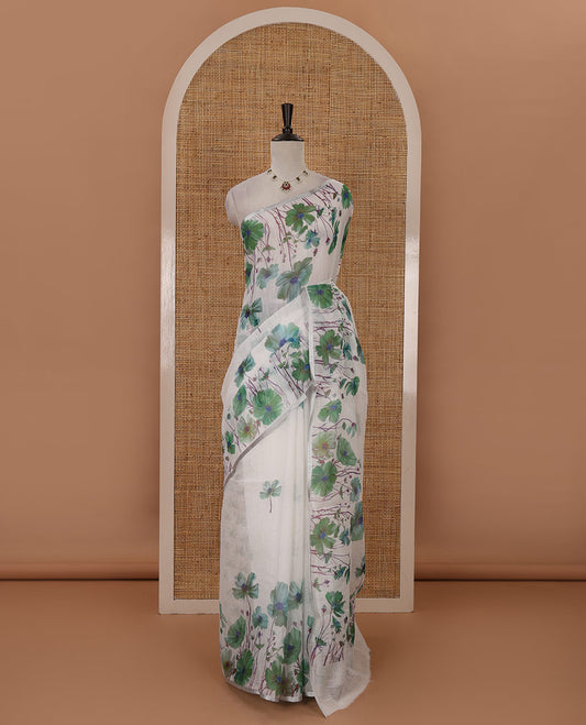 White-base poppy-style green-color floral motifs printed linen saree, piping zari border, pallu steeped with floral print & floral matching blouse