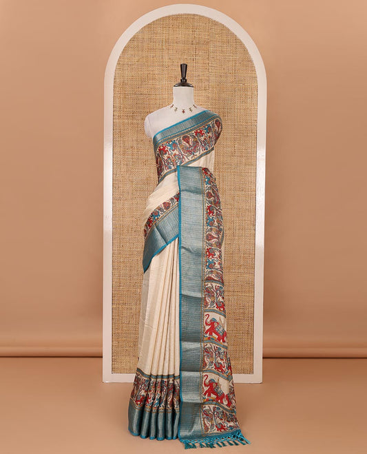 Chikku striped & printed dola silk saree, contrast blue traditional zari border & pallu of elephant & peacock print & contrast printed blouse