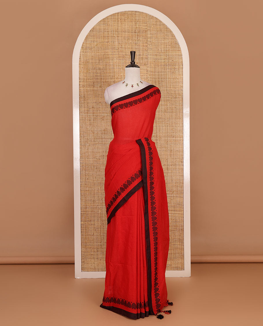 Red plain khadi cotton saree with contrast border and plain pallu with tussels