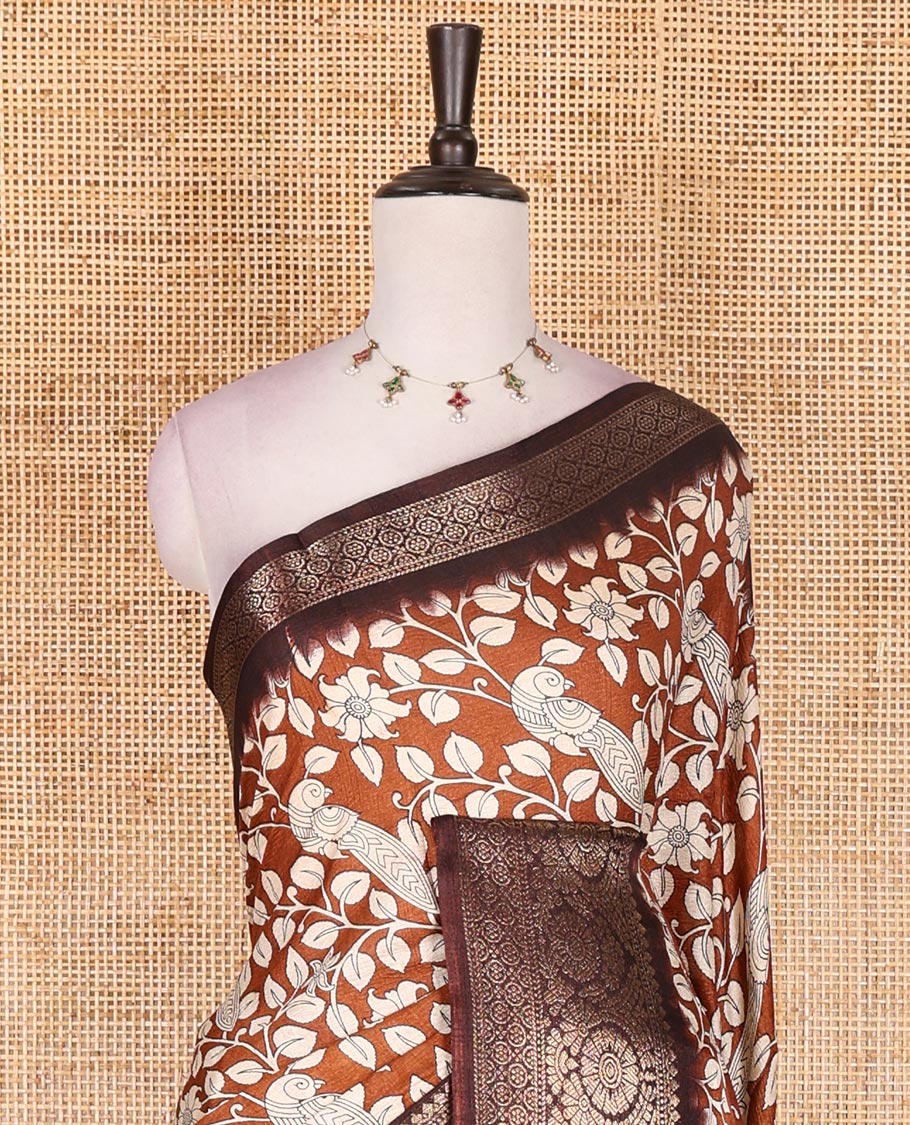 Brown kalamkari floral vine and peacock printed dola silk saree, contrast traditional zari border, peacock printed pallu, and floral vine print blouse