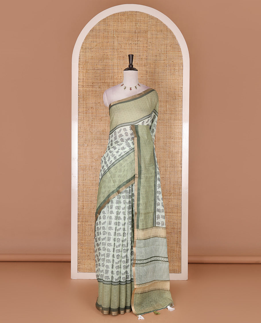 Green cute elephant motifs printed linen cotton saree, contrast chevron border, pallu of stripes and chevron, and contrast printed blouse