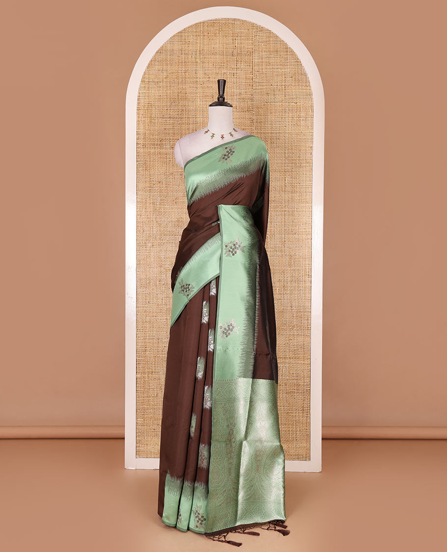 Brown-green floral buttas elite soft silk saree, contrast floral buttas border, and pallu of Mughal-style intricate zari designs