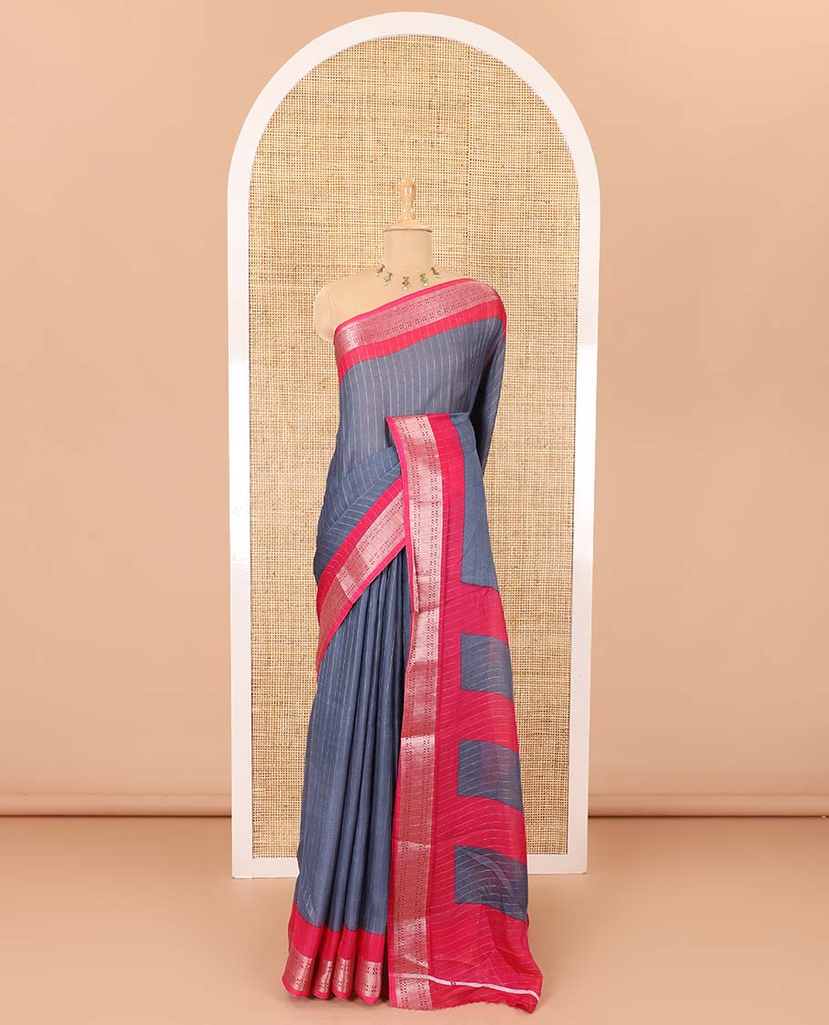 Grey vertically striped moss chiffon saree with contrast traditional zari design borders, striped pallu, and a contrast blouse