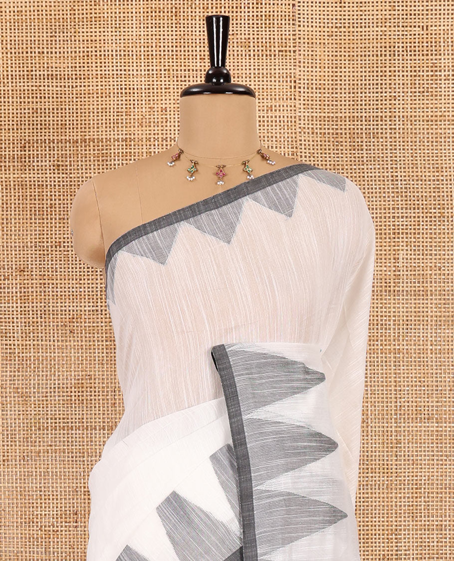 Half-white and grey plain khadi mul cotton saree, contrast thread temple border, plain pallu, and a contrast plain blouse