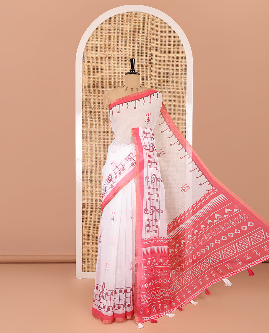 White and pink musical note motifs printed Chanderi cotton saree, zari piping border, geometric printed pallu, and a unique motifs printed blouse