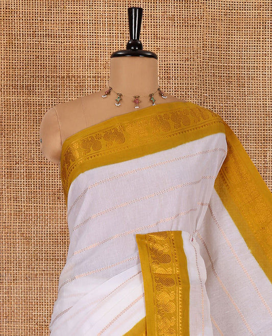 Half-white and yellow Veldhari striped Sungudi cotton saree, contrast traditional border of peacock buttas, zari striped pallu, and a contrast blouse