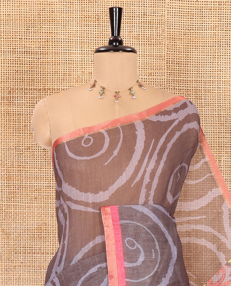 Olive green spiral batik printed linen cotton saree, contrast piping border, floral printed pallu, and a contrast floral printed blouse