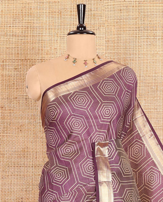 Purple Semi-Tussar Saree Subtly Sparked with Hexagonal Geometric Patterns Printed All Over Its Body, Featuring Traditional Zari Design Border, Gleaming Zari Striped Pallu, and a Matching Blouse