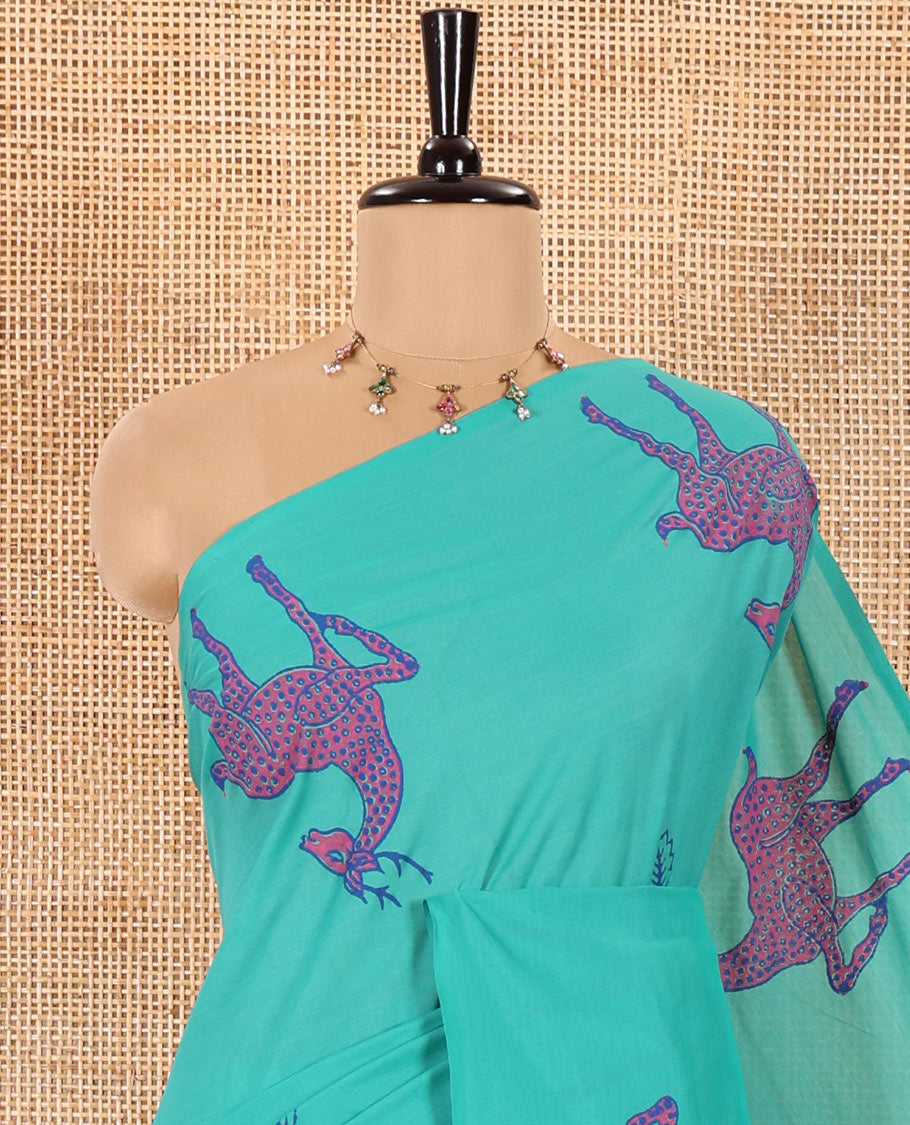 Borderless Peacock Green South Cotton Saree Featuring Leaf and Dotted Deer Motifs Block Printed All Over the Saree, Complemented by a Contrast Floral Motifs Block Printed Blouse