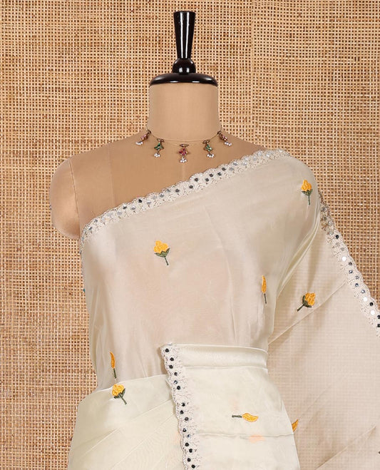 Cream and Yellow Rangoli Saree, Mesmerized with Flower Butta Embroidered All Over Its Body, Scallop Mirror Embroidered Border, Pallu Artfully Woven with Floral Motifs Embroidery, and Paired with a Contrast Embroidered Blouse