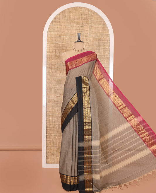 Light Brown Plain Chettinad Cotton Saree, Complemented by a Contrast Kal Erangina Traditional Zari Border of Peacock Designs, Subtly Striped Pallu, and Paired with a Matching Blouse