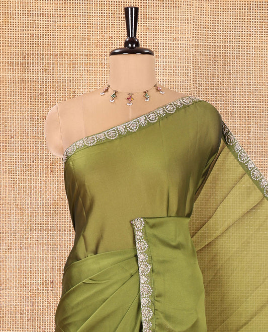 Green Plain Rangoli Chiffon Saree, Embellished with Piping Embroidered Border, Self-Pallu, and Paired with a Matching Embroidered Blouse