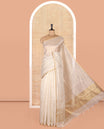 Borderless Off-white Tissue Saree, Richly Detailed with Vertical Golden Zari Stripes All Over Its Body, Highlighted by Gleaming Zari Striped Pallu, and Paired with a Matching Blouse