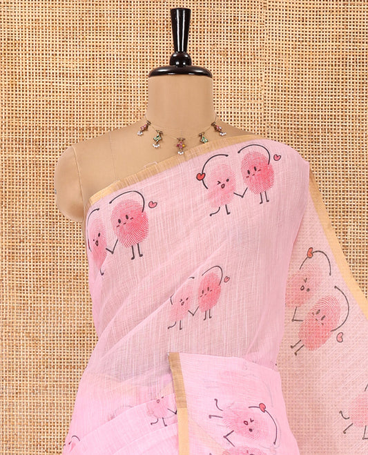 Pink Linen Cotton Saree, Creatively Printed with Thumb Finger Printed Cartoon-Theme Print on Its Body, a Subtle Piping Border, a Self-Printed Pallu, and Paired with a Matching Blouse
