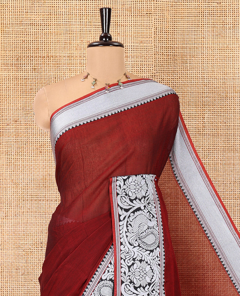 Maroon Plain Mercerised Cotton Saree, Highlighted by a Self-Border of Temple, Peacock, and Floral Designs,  Striped Pallu, and Paired with a Matching Blouse