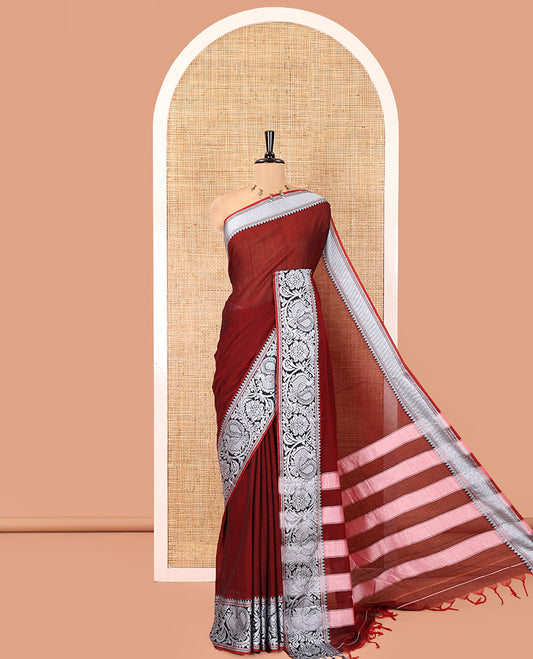 Maroon Plain Mercerised Cotton Saree, Highlighted by a Self-Border of Temple, Peacock, and Floral Designs,  Striped Pallu, and Paired with a Matching Blouse