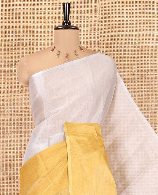 Borderless Yellow Plain Tissue Saree, a Self-Pallu with Tassels, and a Matching Blouse