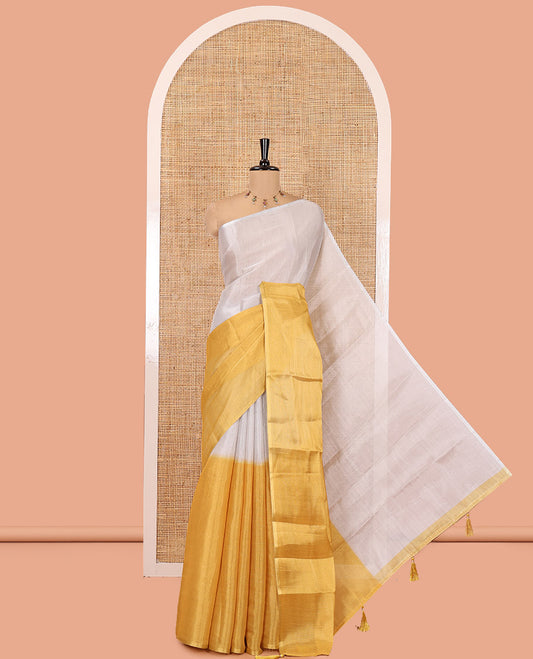 Borderless Yellow Plain Tissue Saree, a Self-Pallu with Tassels, and a Matching Blouse