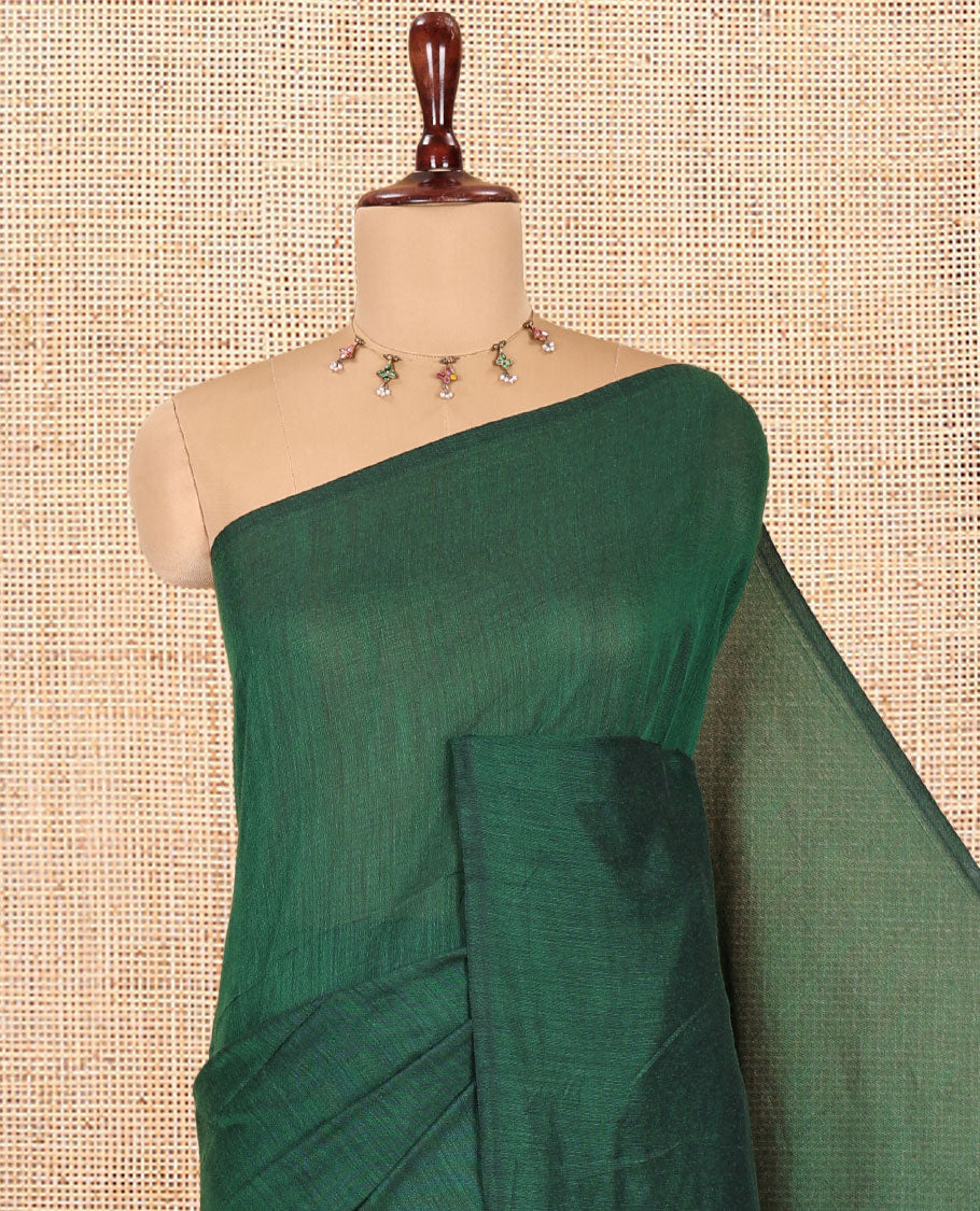 Borderless Green Plain Khadi Cotton Saree, a Self-Pallu with Tassels, and a Matching Blouse