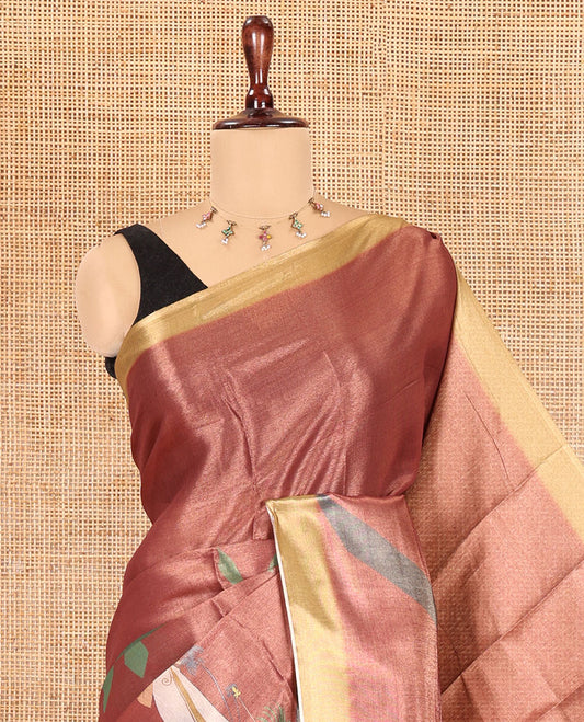 Reddish-Brown Kerala Culture-Themed Tissue Saree Features a Girl, Banana Leaf, and Kolam Motifs, Contrast Border, and Blouse