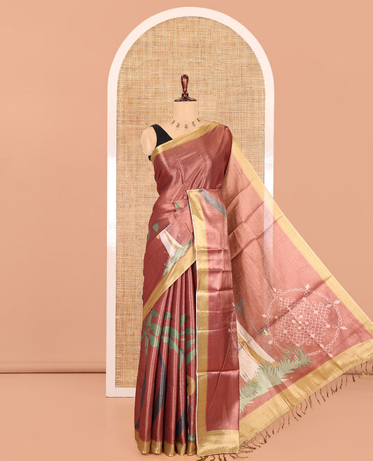 Reddish-Brown Kerala Culture-Themed Tissue Saree Features a Girl, Banana Leaf, and Kolam Motifs, Contrast Border, and Blouse