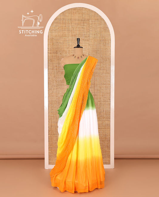 Multi-color half-saree, ombre-colored viscose georgette skirt, a plain light green blouse, and a ombre-colored zari striped dhavani