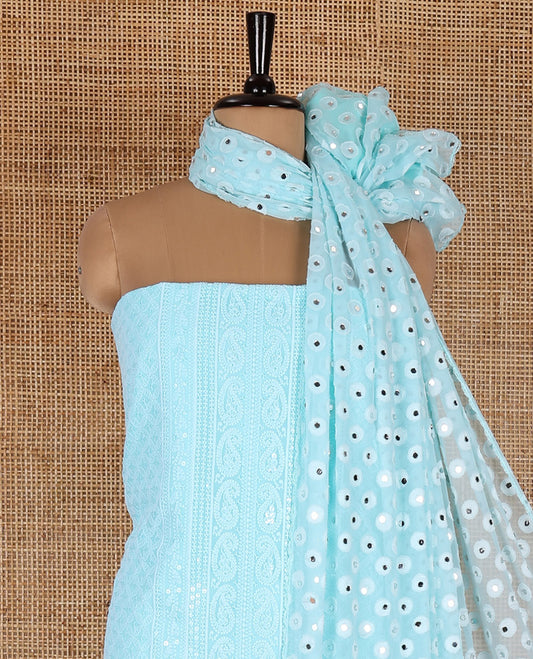 Aqua material chudidar set, paisleys and jaal schiffli sequins embroidered mul georgette top, a matching bottom, and a mirror work dupatta