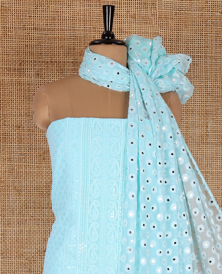 Aqua material chudidar set, paisleys and jaal schiffli sequins embroidered mul georgette top, a matching bottom, and a mirror work dupatta