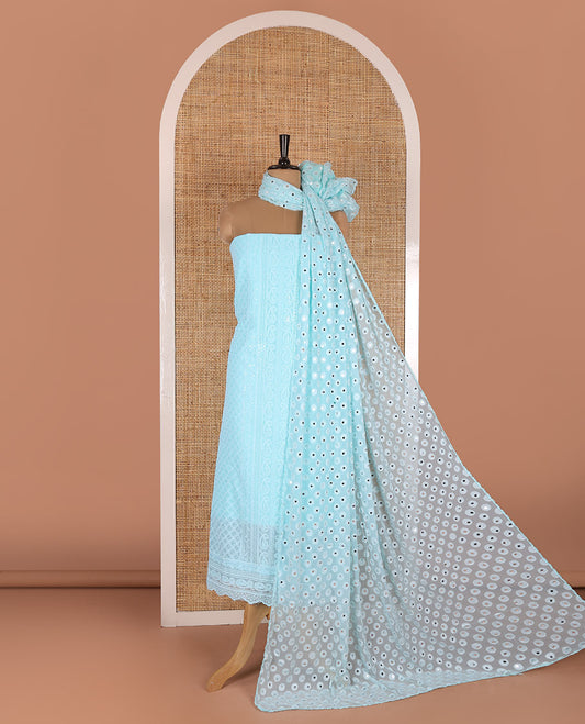 Aqua material chudidar set, paisleys and jaal schiffli sequins embroidered mul georgette top, a matching bottom, and a mirror work dupatta