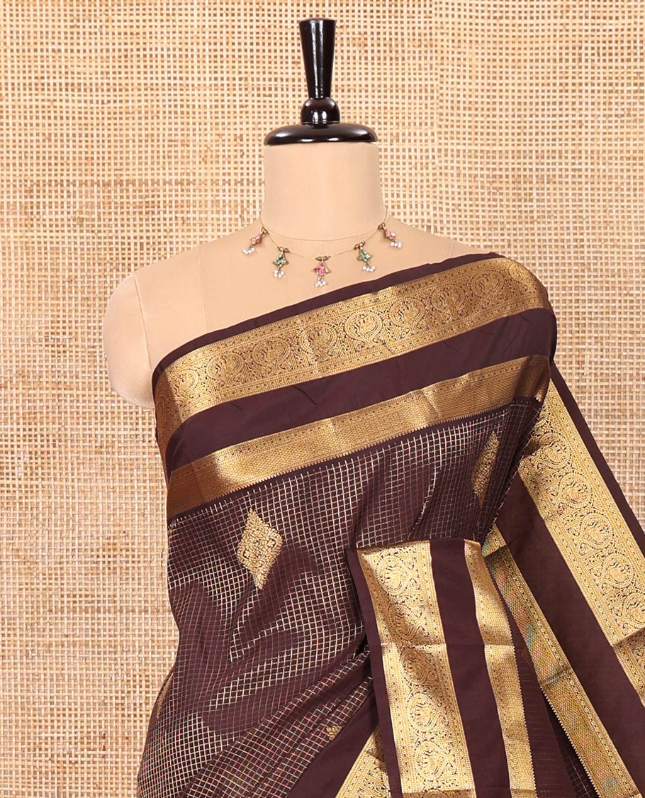 Coffee Brown Kanchipuram Budget Silk Saree Embellished with Zari Buttas and Zari Micro-Checks, Highlighted by Rettai Pettu Traditional Zari Design Border, Intricately Decked Up Pallu of Big Paisley Designs, and Paired with a Matching Blouse
