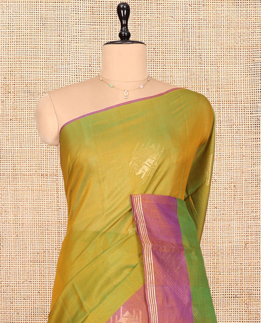 Green Silk Cotton Saree, Decked Up with Zari Buttas, Complemented by Contrast Zari Border, a Pallu of Geometric Designs, and Contrast Blouse