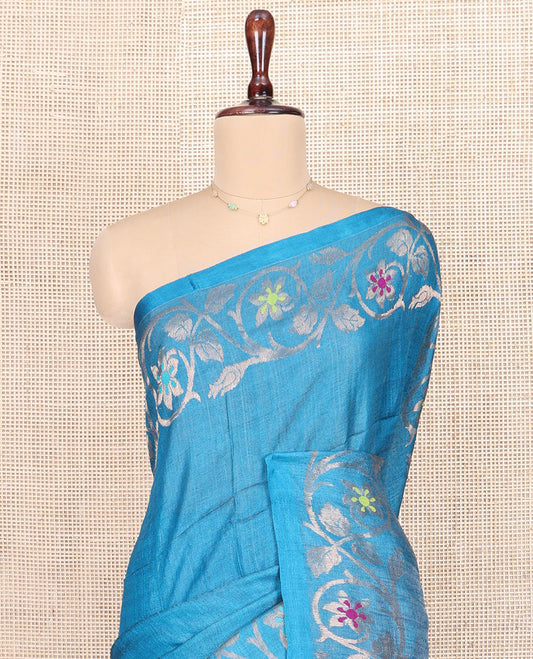 Blue Plain Tussar Silk Saree, Highlighted by Floral Creeper Design Border, Gleaming Zari Pallu, and Paired with a Contrast Blouse
