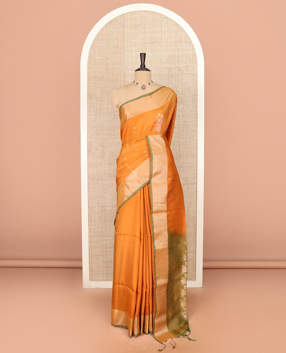 Orange Semi Uppada Saree Bedecked with Zari Buttas, Complemented by a Contrasting Bavanji Border, Pallu Featuring Paisley Butta Enclosed Circles, and Paired with a Contrast Blouse