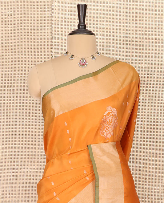 Orange Semi Uppada Saree Bedecked with Zari Buttas, Complemented by a Contrasting Bavanji Border, Pallu Featuring Paisley Butta Enclosed Circles, and Paired with a Contrast Blouse