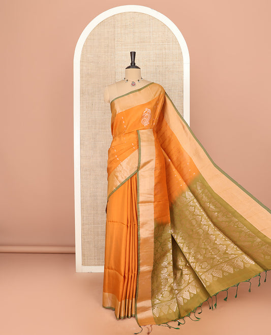 Orange Semi Uppada Saree Bedecked with Zari Buttas, Complemented by a Contrasting Bavanji Border, Pallu Featuring Paisley Butta Enclosed Circles, and Paired with a Contrast Blouse