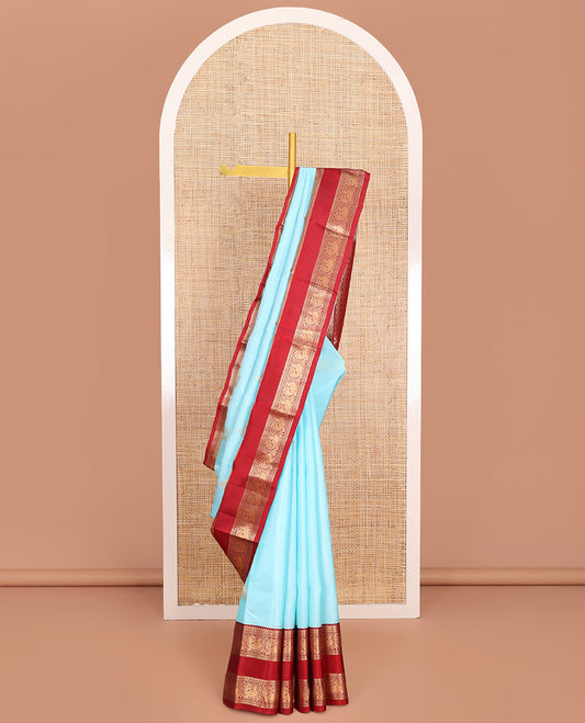 Blue Vasundhara Lite-Silk Mix Saree, Gleamed Up with Zari Buttas, Complemented by Contrast Rettai Pettu Border Featuring Diamond, Neli, Muthu, and Mayil Designs, Grandly Woven Pallu of Jaal Designs, and Paired with a Contrast Blouse