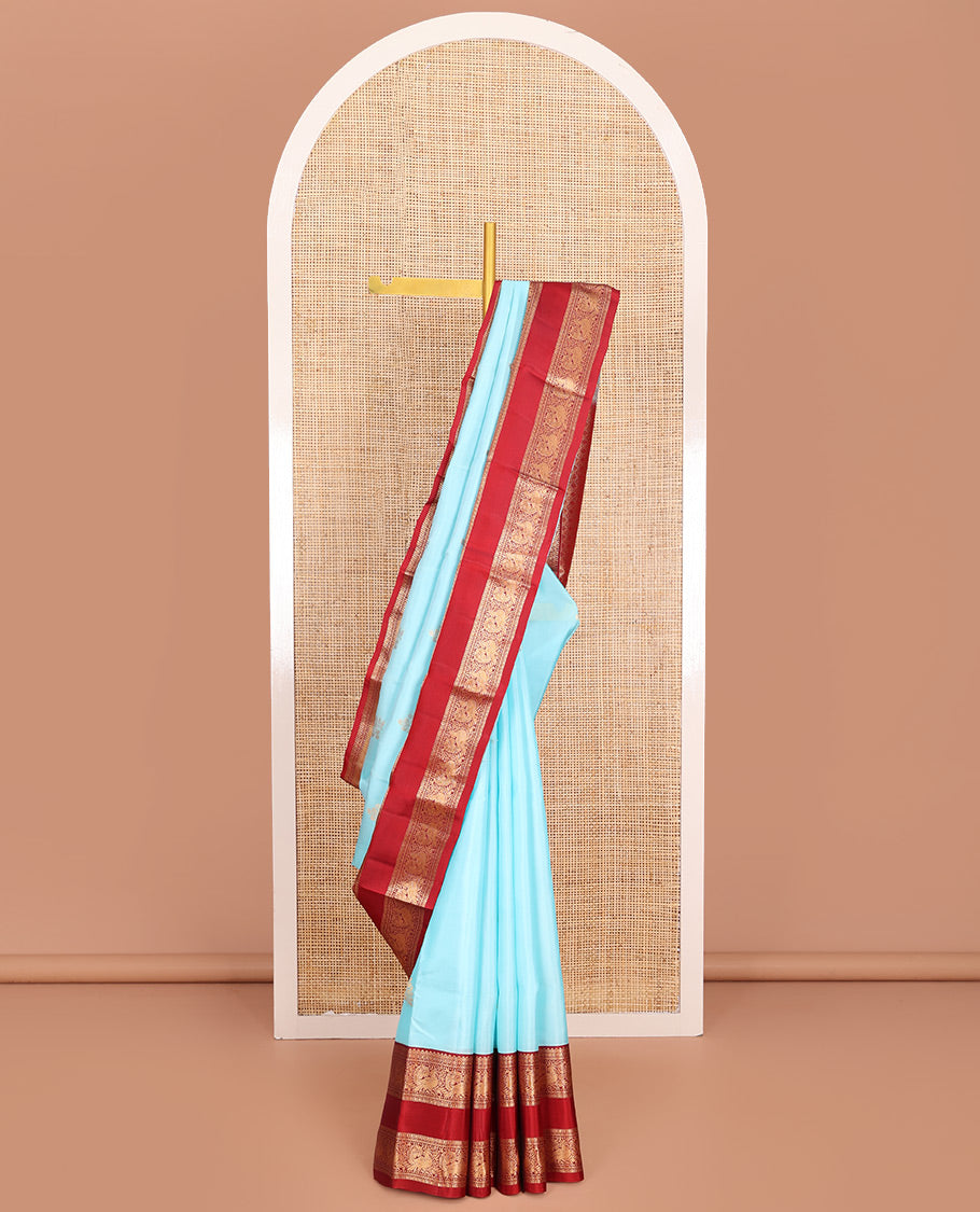 Blue Vasundhara Lite-Silk Mix Saree, Gleamed Up with Zari Buttas, Complemented by Contrast Rettai Pettu Border Featuring Diamond, Neli, Muthu, and Mayil Designs, Grandly Woven Pallu of Jaal Designs, and Paired with a Contrast Blouse