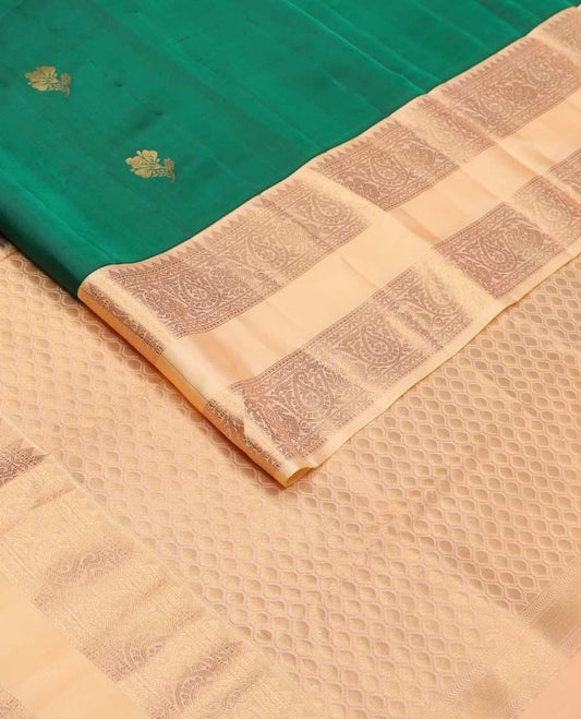 Green zari buttas Vasundhara silk mix saree, contrast rettai pettu border of rekku, muthu, neli, and manga designs, and ogee patterned pallu