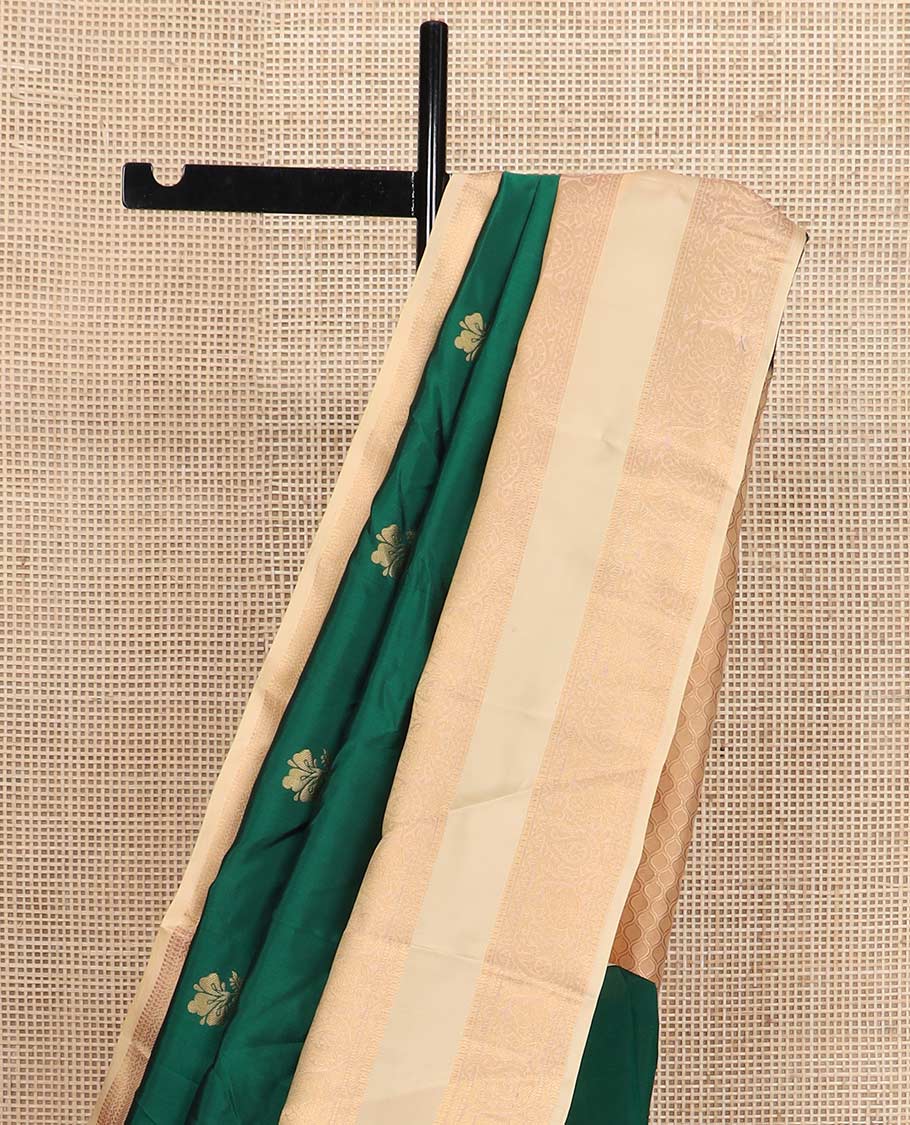 Green zari buttas Vasundhara silk mix saree, contrast rettai pettu border of rekku, muthu, neli, and manga designs, and ogee patterned pallu