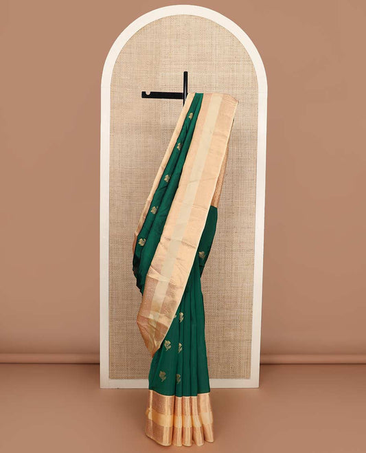 Green zari buttas Vasundhara silk mix saree, contrast rettai pettu border of rekku, muthu, neli, and manga designs, and ogee patterned pallu