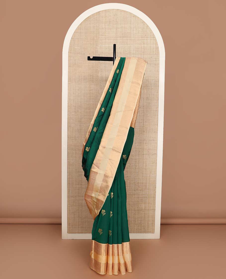 Green zari buttas Vasundhara silk mix saree, contrast rettai pettu border of rekku, muthu, neli, and manga designs, and ogee patterned pallu