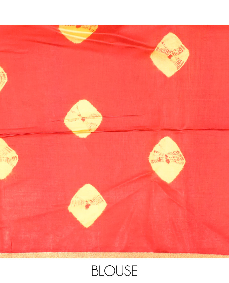 Red and yellow shibori printed banana pith saree, zari piping border, and zari striped pallu